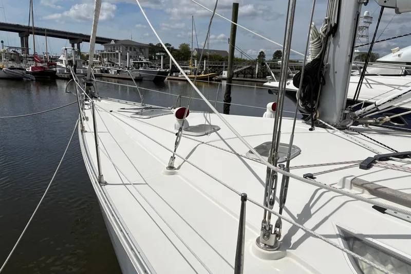 Slide: The Image of Jeanneau Sun Odyssey 45.2 sailboat docked at marina, 1998 model, clear sky. - 4