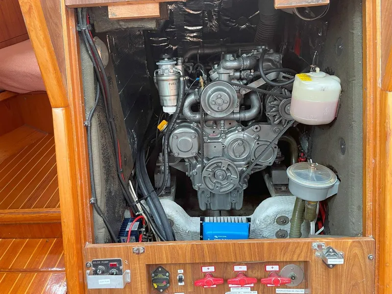 Slide: The Image of Engine compartment of a 1998 Jeanneau Sun Odyssey 45.2 sailboat, showcasing mechanical components. - 41