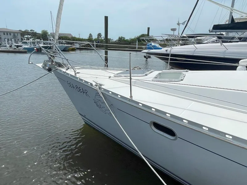 Slide: The Image of 1998 Jeanneau Sun Odyssey 45.2 sailboat docked in a marina. - 5