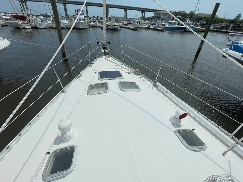 Slide: The Image of Deck view of 1998 Jeanneau Sun Odyssey 45.2 sailboat in marina. - 7