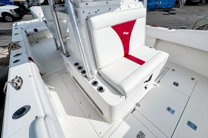 Slide: The Image of 2004 SeaVee 340i Cuddy boat interior with white and red seating. - 13