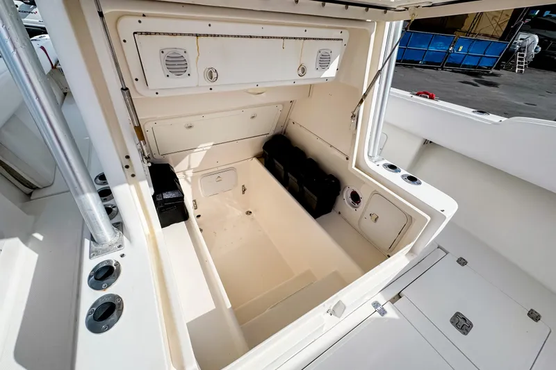 Slide: The Image of 2004 SeaVee 340i Cuddy boat interior storage compartment, open and spacious design. - 14