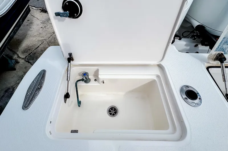 Slide: The Image of Open storage compartment on 2004 SeaVee 340i Cuddy boat deck. - 4