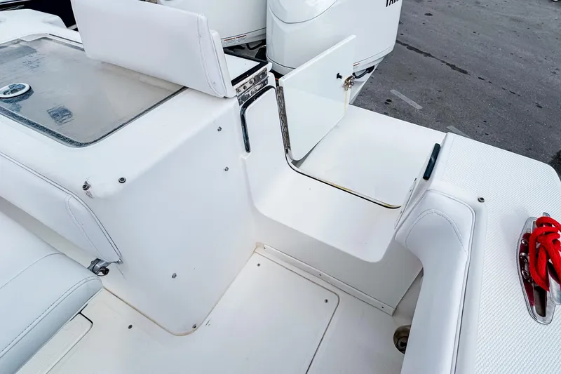 Slide: The Image of 2004 SeaVee 340i Cuddy boat interior with open storage compartment and seating. - 5