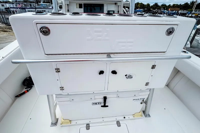 Slide: The Image of 2004 SeaVee 340i Cuddy boat deck with storage compartments and Yeti cooler. - 6