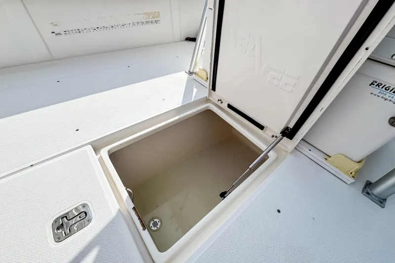 Slide: The Image of Open storage compartment on 2004 SeaVee 340i Cuddy boat deck. - 9