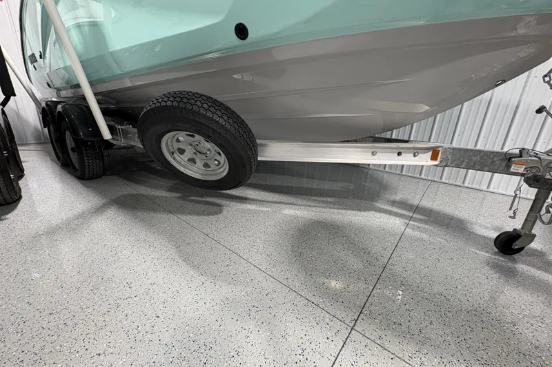 Slide: The Image of 2023 Yamaha Boats 222 FSH Sport on trailer in storage facility. - 13