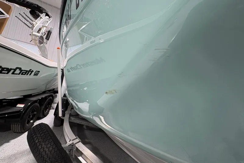 Slide: The Image of 2023 Yamaha Boats 222 FSH Sport on trailer in showroom. - 15