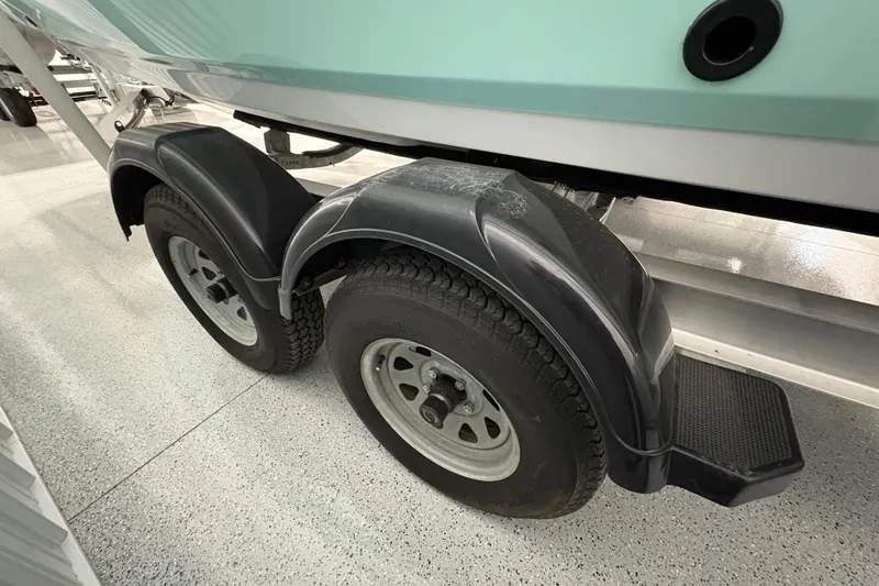 Slide: The Image of 2023 Yamaha Boats 222 FSH Sport hull on trailer in storage facility. - 20