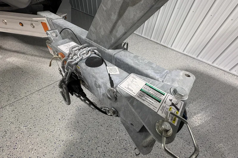 Slide: The Image of 2023 Yamaha Boats 222 FSH Sport side view with American flag in background. - 26