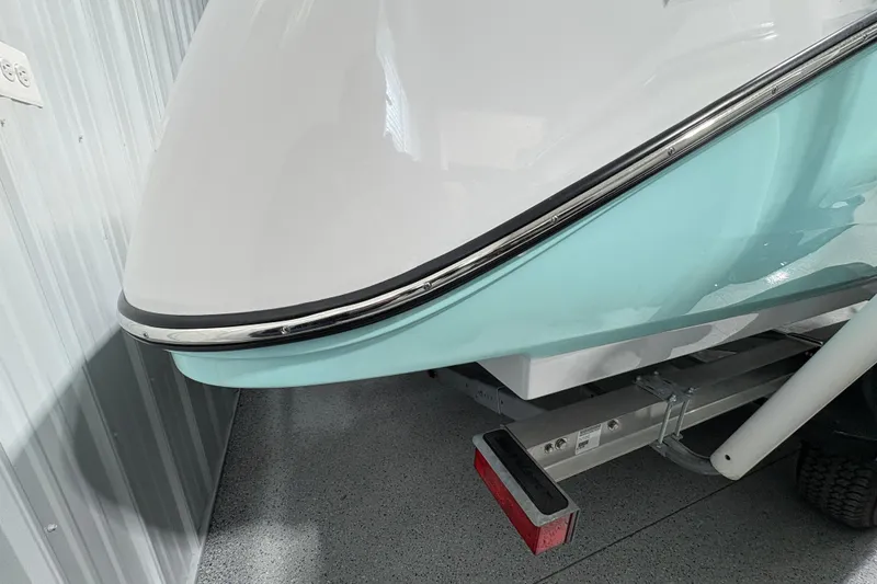 Slide: The Image of 2023 Yamaha Boats 222 FSH Sport, close-up of rear ladder and engine components. - 36