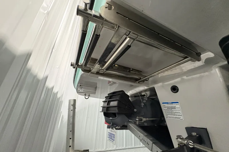 Slide: The Image of 2023 Yamaha Boats 222 FSH Sport interior with white seating and modern design. - 48