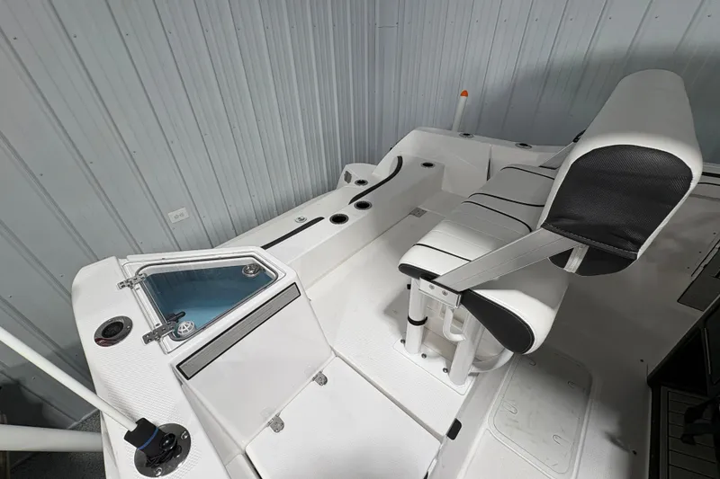 Slide: The Image of 2023 Yamaha Boats 222 FSH Sport interior with modern helm and seating. - 52