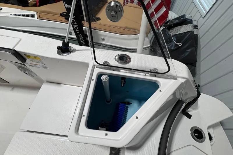 Slide: The Image of 2023 Yamaha Boats 222 FSH Sport dashboard with steering wheel and controls. - 58