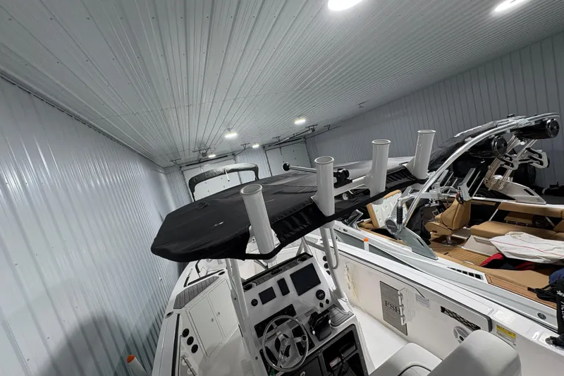 Slide: The Image of Control panel of 2023 Yamaha Boats 222 FSH Sport with labeled switches and warning labels. - 64