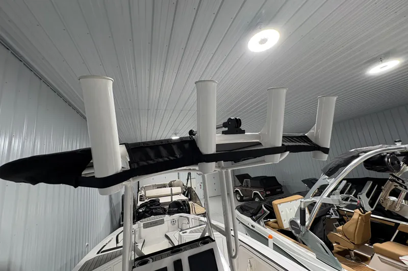 Slide: The Image of Control panel of 2023 Yamaha Boats 222 FSH Sport with keys and blower switch. - 65