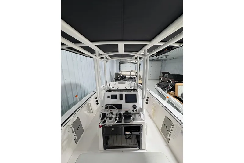 Slide: The Image of 2023 Yamaha Boats 222 FSH Sport dashboard with controls and display screen. - 72
