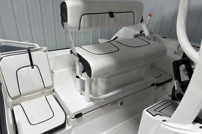 Slide: The Image of 2023 Yamaha Boats 222 FSH Sport interior view, showcasing T-top and console. - 73