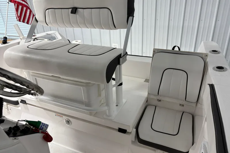 Slide: The Image of 2023 Yamaha Boats 222 FSH Sport interior, showcasing sleek design and modern features. - 74