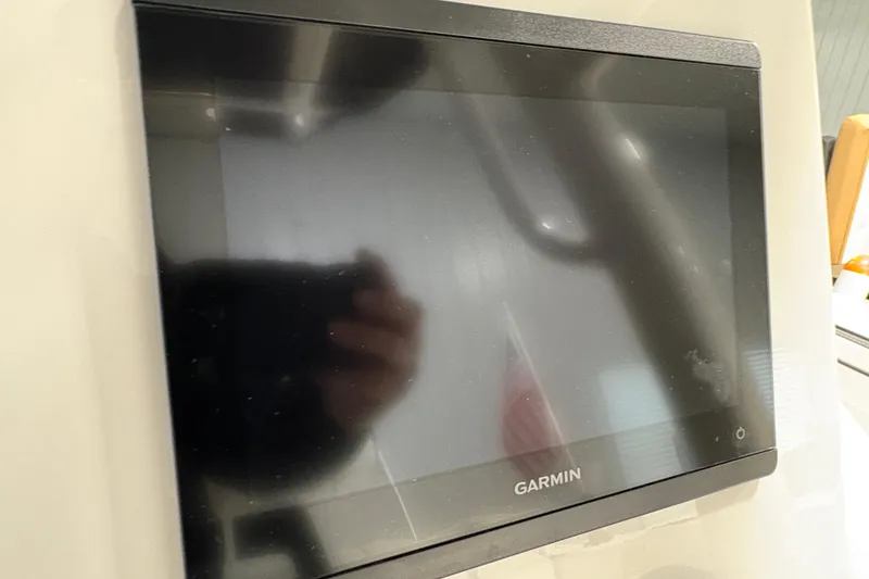 Slide: The Image of 2023 Yamaha Boats 222 FSH Sport interior with seating and storage features. - 79