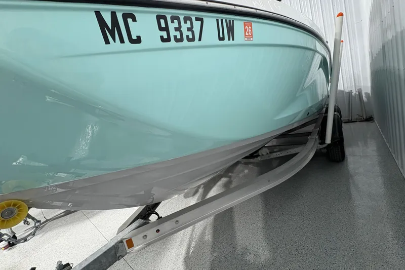 Slide: The Image of 2023 Yamaha Boats 222 FSH Sport on trailer in storage facility. - 8