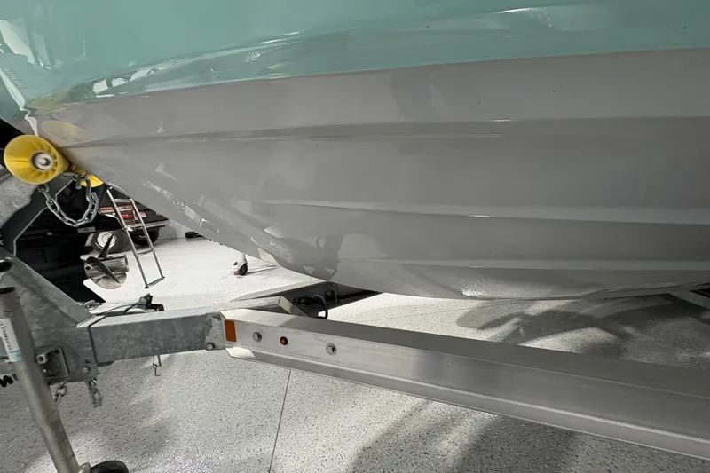 Slide: The Image of 2023 Yamaha Boats 222 FSH Sport interior with American flag, showcasing sleek design. - 9