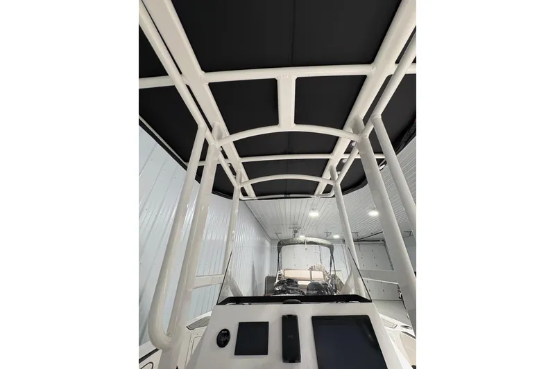 Slide: The Image of 2023 Yamaha Boats 222 FSH Sport interior with white and black seating. - 90