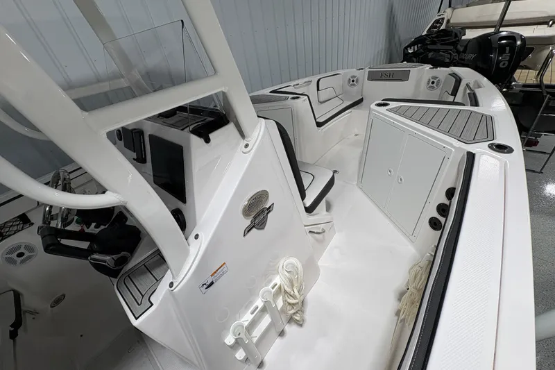 Slide: The Image of 2023 Yamaha Boats 222 FSH Sport interior with seating and speakers. - 91