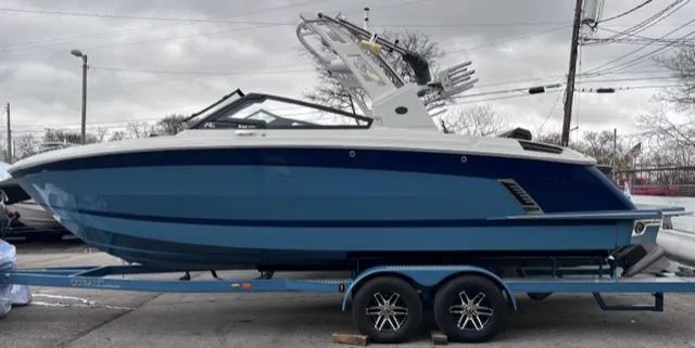Slide: The Image of 2023 Cobalt R6 Surf boat on trailer, side view. - 2
