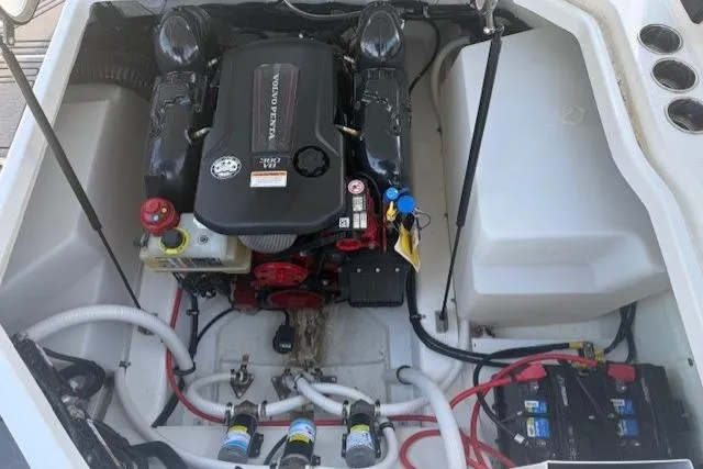 Slide: The Image of 2023 Cobalt R6 Surf boat engine compartment with Volvo Penta engine and battery setup. - 20