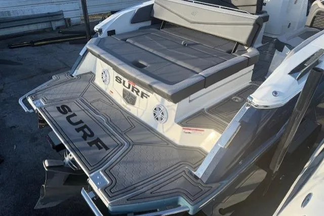 Slide: The Image of 2023 Cobalt R6 Surf boat with sleek design and spacious seating area. - 22