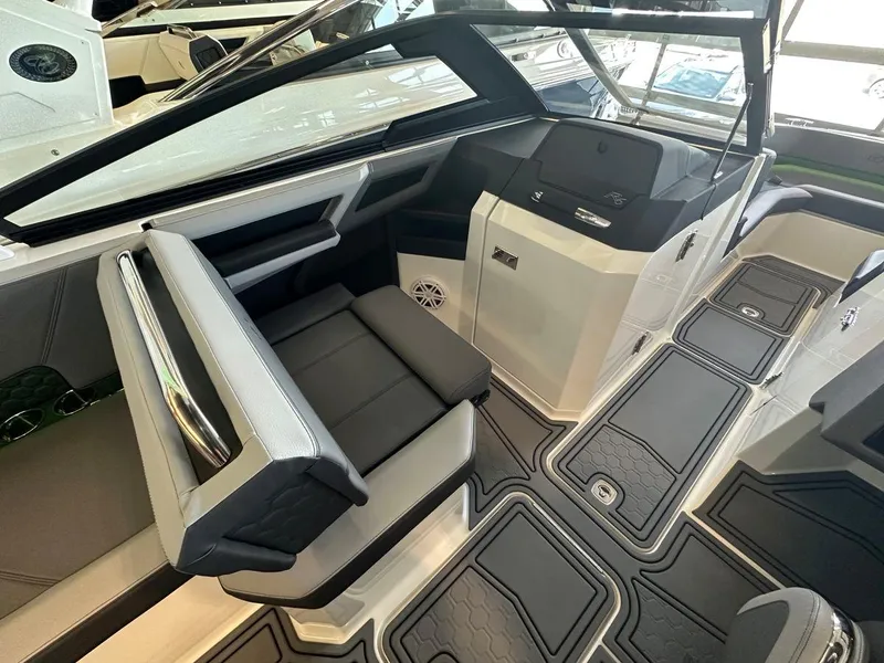 Slide: The Image of Interior of 2023 Cobalt R6 Surf boat, featuring modern seating and dashboard. - 3