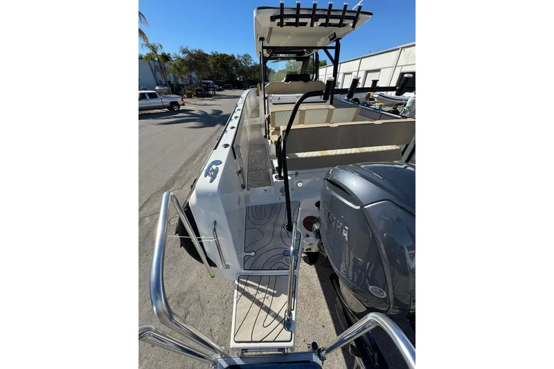 Slide: The Image of 2026 Zodiac X10CC boat with sleek design and powerful engine, parked outdoors. - 4