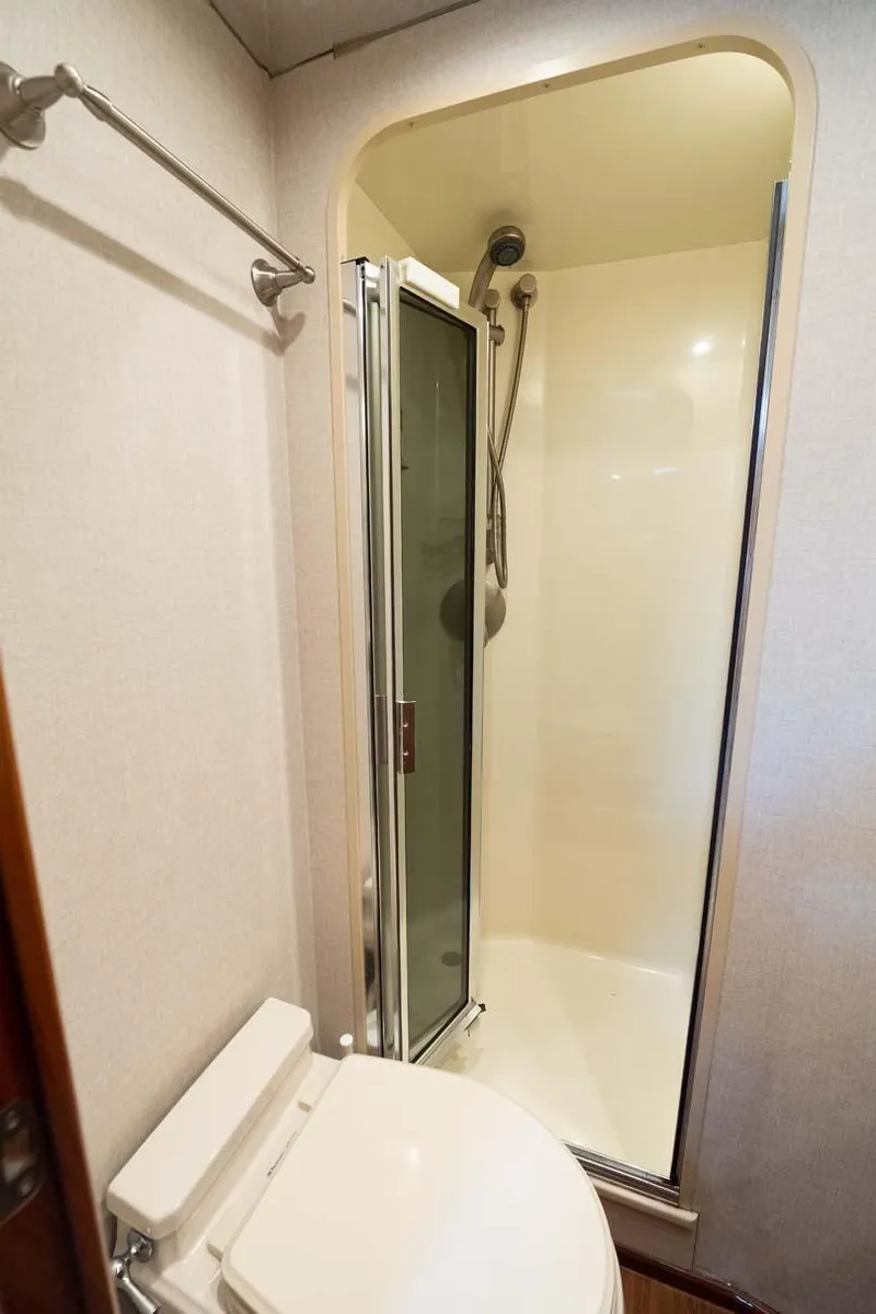 Slide: The Image of 2007 Viking 64 Convertible yacht bathroom with shower and toilet. - 15
