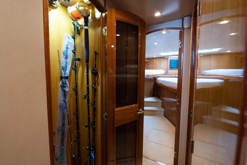 Slide: The Image of Interior of 2007 Viking 64 Convertible yacht with fishing rods and cozy cabin. - 16