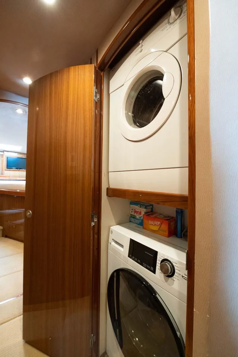 Slide: The Image of Stacked washer and dryer in 2007 Viking 64 Convertible yacht interior. - 19