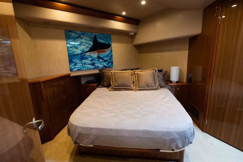 Slide: The Image of Luxurious bedroom in 2007 Viking 64 Convertible yacht with elegant decor and artwork. - 20