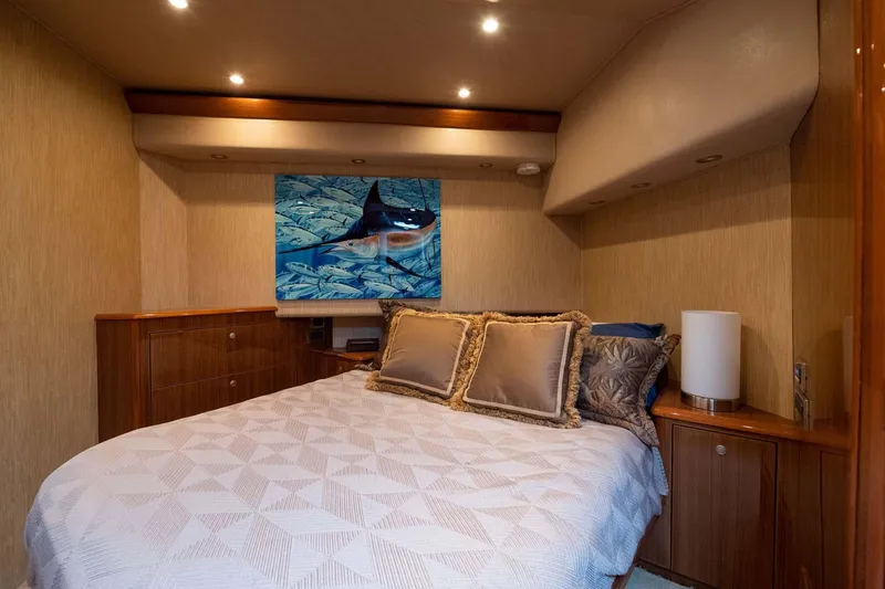 Slide: The Image of Luxurious bedroom interior of 2007 Viking 64 Convertible yacht with elegant bedding and artwork. - 23