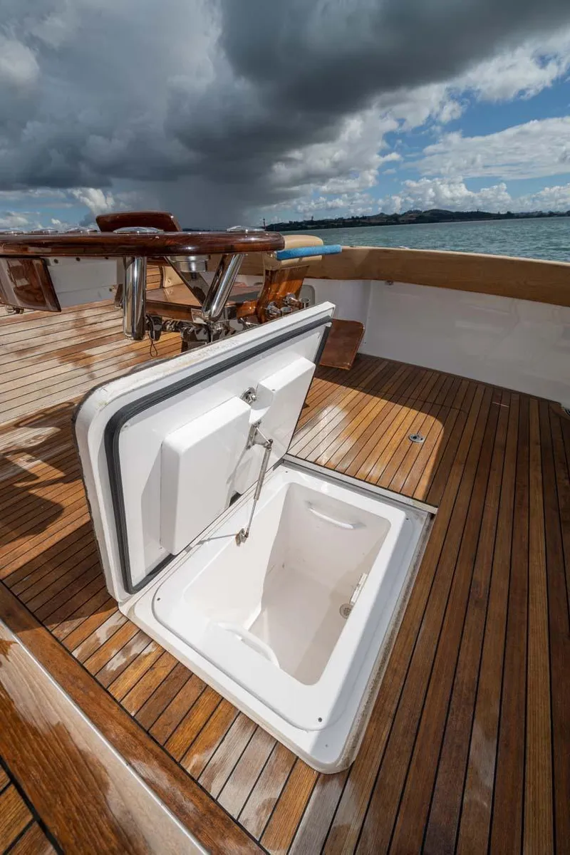 Slide: The Image of Open hatch on 2007 Viking 64 Convertible yacht deck, under cloudy sky. - 38