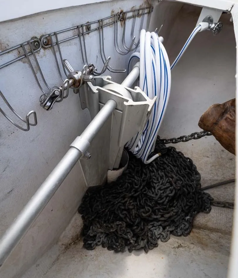 Slide: The Image of Anchor and chain storage on a 2007 Viking 64 Convertible boat. - 43