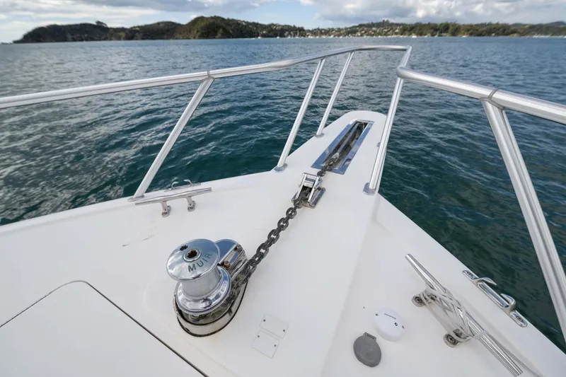 Slide: The Image of Bow of 2007 Viking 64 Convertible yacht with anchor chain, on calm water. - 44