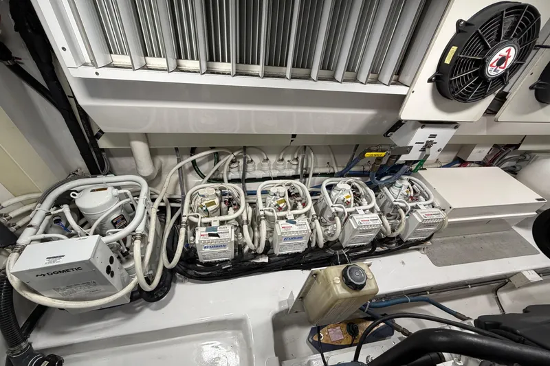 Slide: The Image of Engine room of 2007 Viking 64 Convertible yacht, showcasing mechanical components and systems. - 87