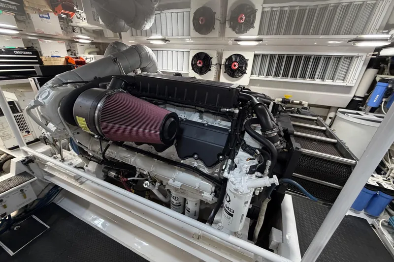 Slide: The Image of Engine room of 2007 Viking 64 Convertible yacht, featuring a powerful marine engine. - 88