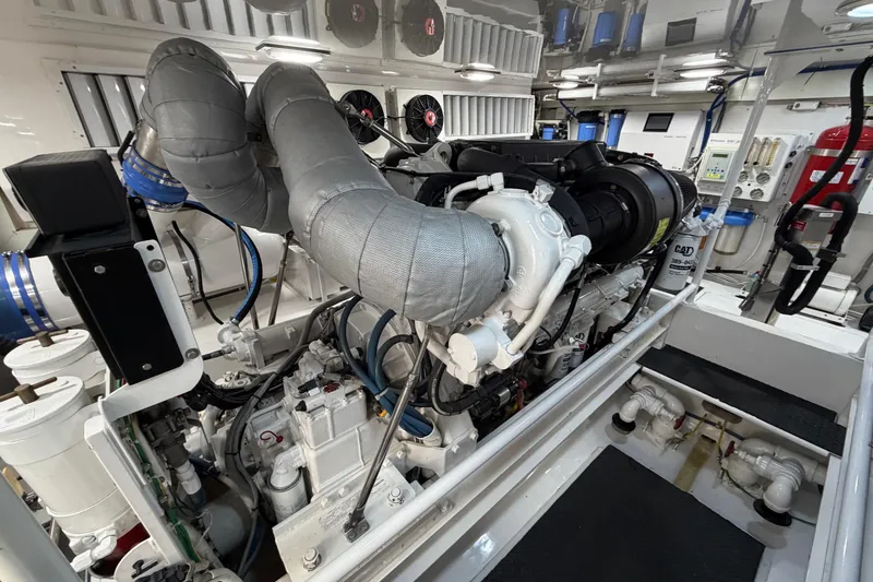 Slide: The Image of Engine room of a 2007 Viking 64 Convertible yacht, showcasing advanced machinery and components. - 93
