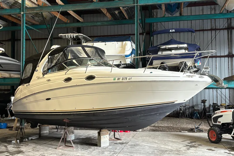 The Image of 2002 Sea Ray Sundancer 280 boat with black canopy on display. - 0