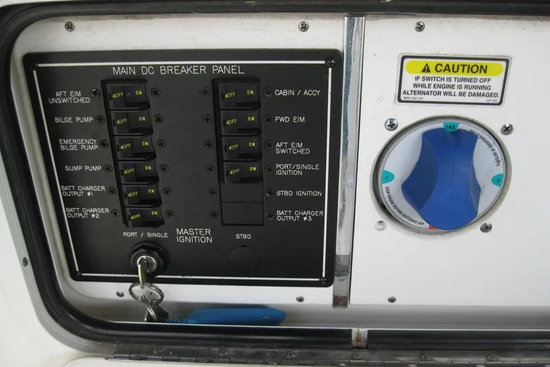 Slide: The Image of 2002 Sea Ray Sundancer 280 interior seating with white upholstery and sunlight shadows. - 15