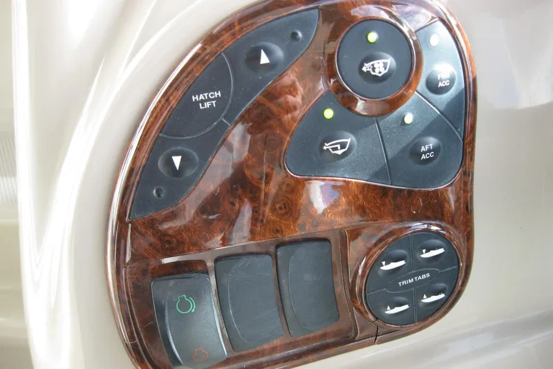 Slide: The Image of Dashboard of 2002 Sea Ray Sundancer 280 with wood finish and multiple gauges. - 19