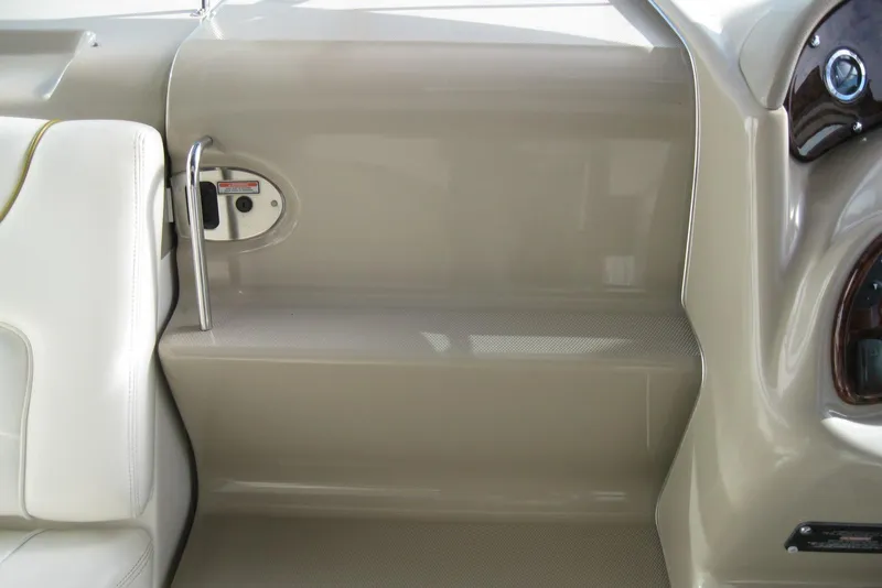 Slide: The Image of Cockpit sink and cup holders on 2002 Sea Ray Sundancer 280 boat. - 23