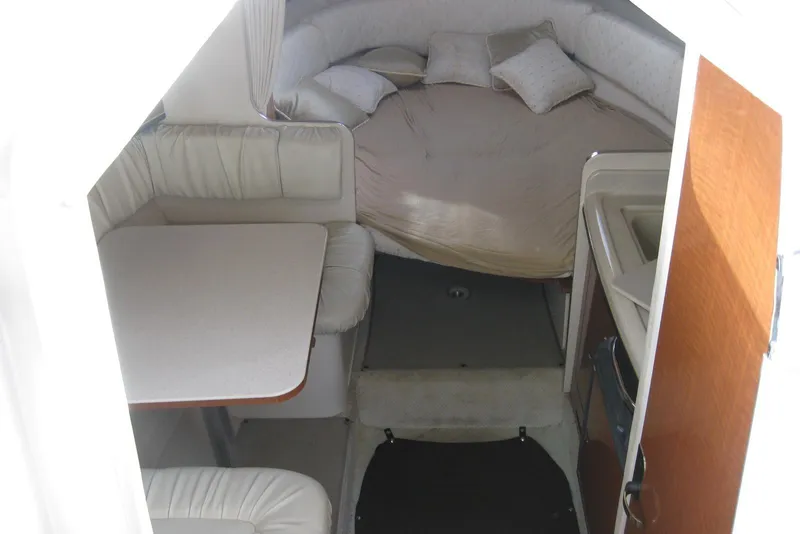 Slide: The Image of 2002 Sea Ray Sundancer 280 cockpit view with windshield and water splashes. - 25
