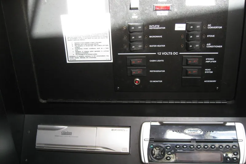 Slide: The Image of Interior cabin of 2002 Sea Ray Sundancer 280 with quilted bedding. - 31